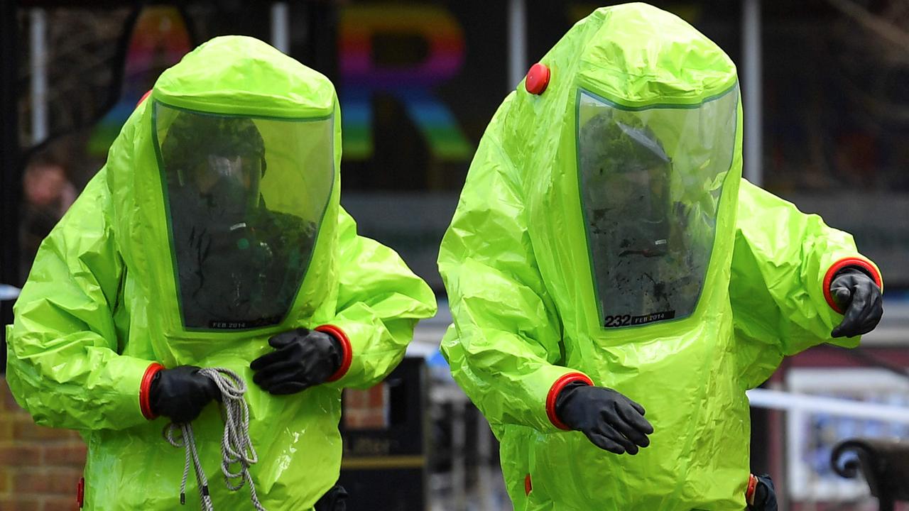 Workers in biohazard suits where former Russian spy Sergei Skripal and his daughter Yulia were found on March 4 2018 in critical condition in Salisbury, England. Picture: AFP PHOTO / Ben STANSALL.