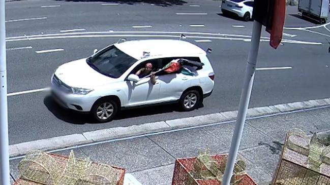 About 2pm on Christmas Day, two vehicles stopped outside a building on New South Head Road, Double Bay, before the occupants got out and a flag was torn from a flagpole.