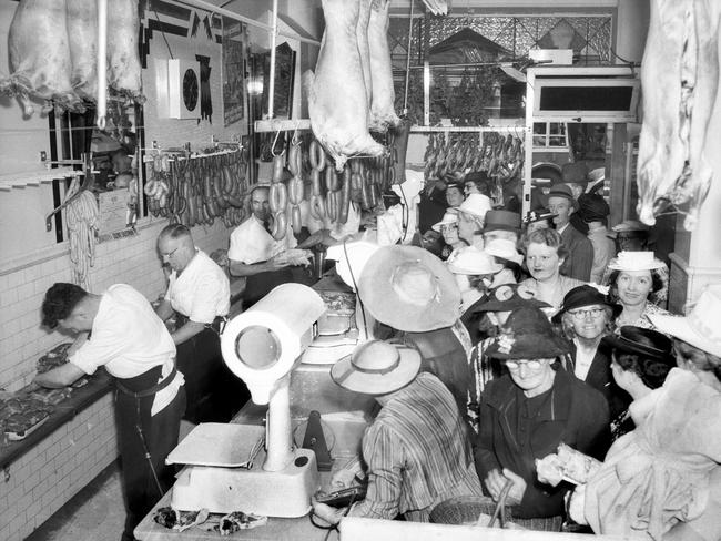 People rush to the butcher’s in 1944, during World War II rationing Source: Krischock Studio.