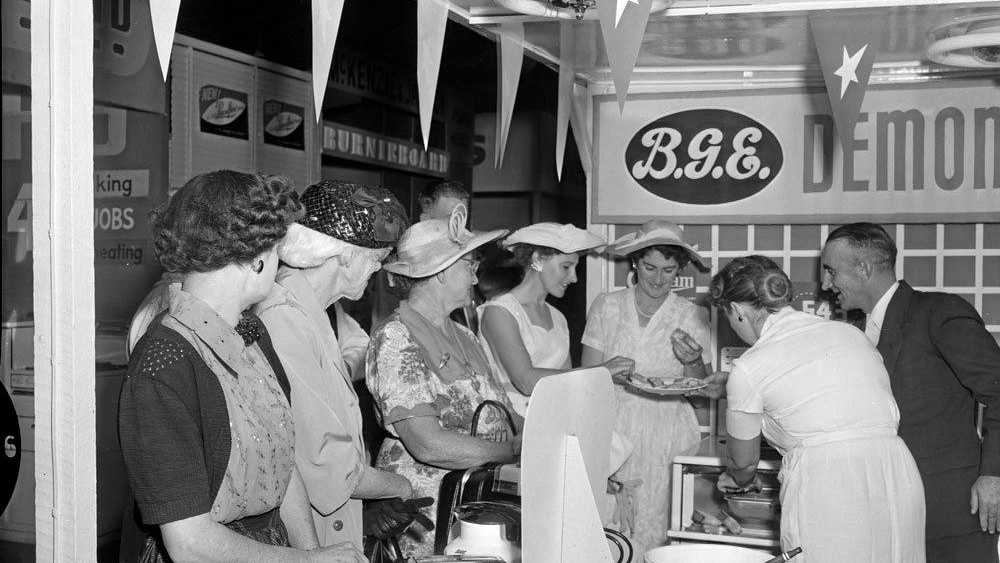 Cooking demonstration at a display stand of RT Edwards at the 1957 Ipswich Show. Picture: Whitehead Studios collection, Pi