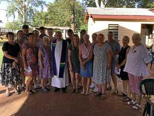 Fr Jamie Collins with attendees of the Mungalalla Christmas mass. Picture: David Bowden