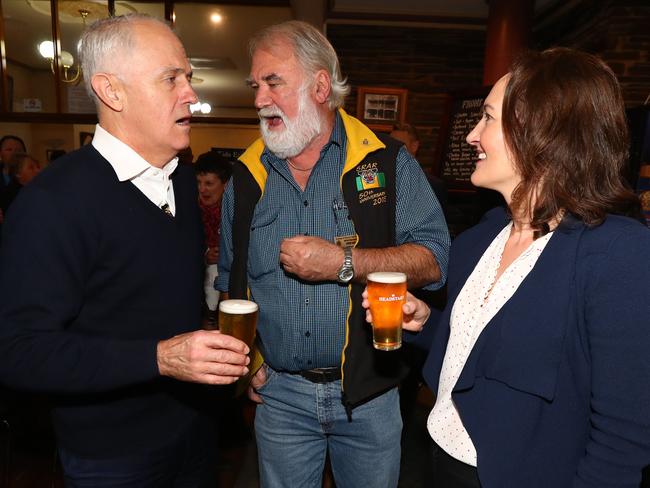 CHEERS: Prime Minister Malcolm Turnbull with local Mostyn Hancock and Liberal candidate for Mayo Georgina Downer at the Alma hotel in Willunga on Friday night. <b>Picture: TAIT SCHMAAL</b>