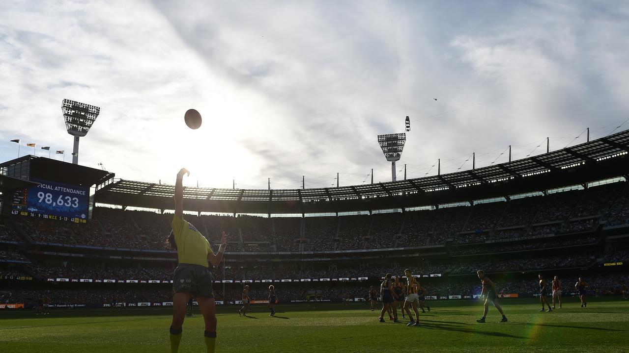 A boundary umpire throws the ball in. AAP Image/Julian Smith.