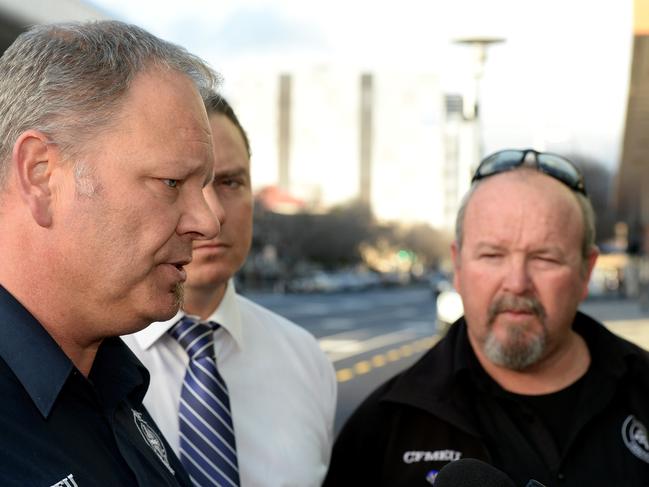 CFMEU organiser Jim O'Connor (right) will be penalised today, in the Federal Court, for contempt of court. State secretary Aaron Cartlidge (left) speaks to media.