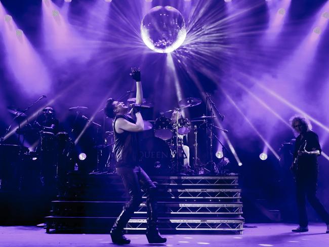 Adam Lambert on stage with Queen.