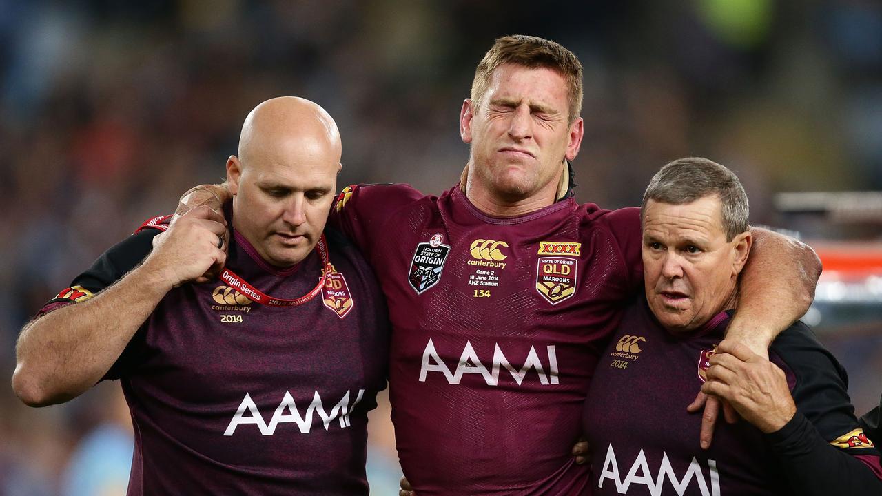 SYDNEY, AUSTRALIA - JUNE 18: Brent Tate of the Maroons is helped off the field after an injury during game two of the State of Origin series between the New South Wales Blues and the Queensland Maroons at ANZ Stadium on June 18, 2014 in Sydney, Australia. (Photo by Matt King/Getty Images)