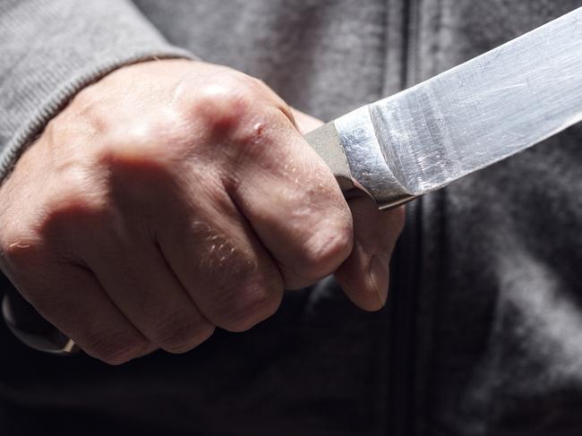 Generic crime Istock  -  Criminal with knife weapon threatening to stab