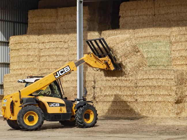 GRAIN: Export Hay - Mark Cossar at Natte YallockMark Cossar on his farm at Natte YallockPICTURED: Generic hay. Hay bales. Big squares. Hay in shed. Oat and hay. JCB telehandler. Stock photo.Picture: Zoe Phillips
