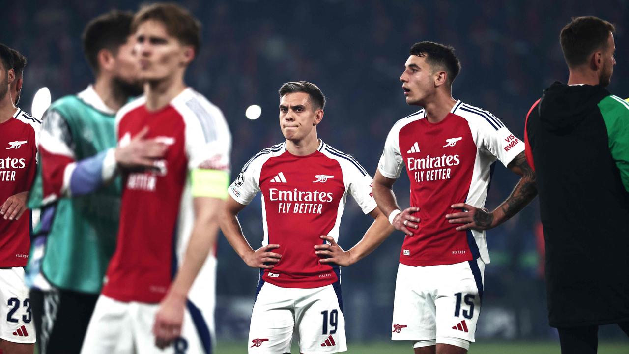 Arsenal players react after losing the Champions League semi-final. (Photo by Thibaud MORITZ / AFP)