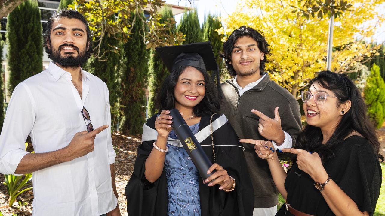 Master of Professional Accounting graduate Moumita Das celebrates her achievement with (from left) Karna Patel, Lahon Hossain and Krishna Ridham at a UniSQ graduation ceremony at Empire Theatres, Tuesday, June 27, 2023. Picture: Kevin Farmer