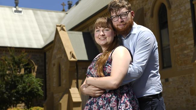 Joel Goddard and Rebekah Wintulich at Trinity Church on Morphett Street, where they still plan to marry on Friday despite restrictions. Picture: Naomi Jellicoe