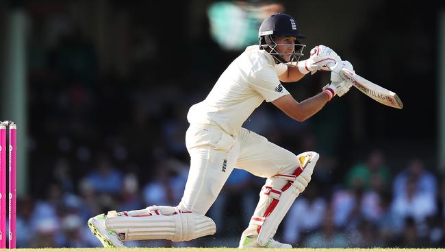 England captain Joe Root pushes through the covers at the SCG yesterday. Picture: Brett Costello