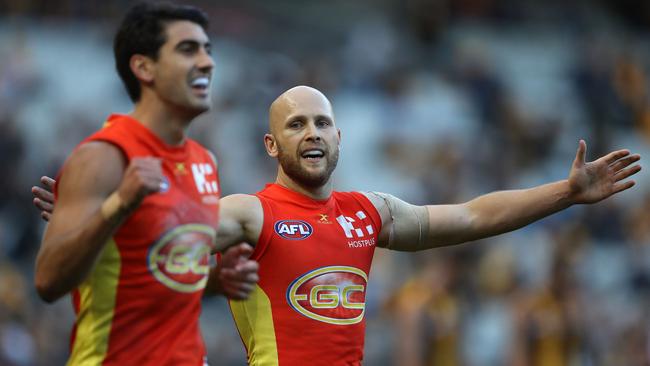 Gary Ablett and Matt Rosa celebrate Gold Coast’s win over Hawthorn.