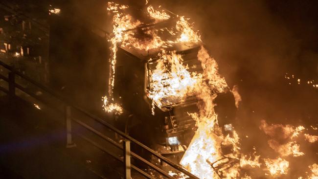 The police truck on fire. Picture: Getty Images