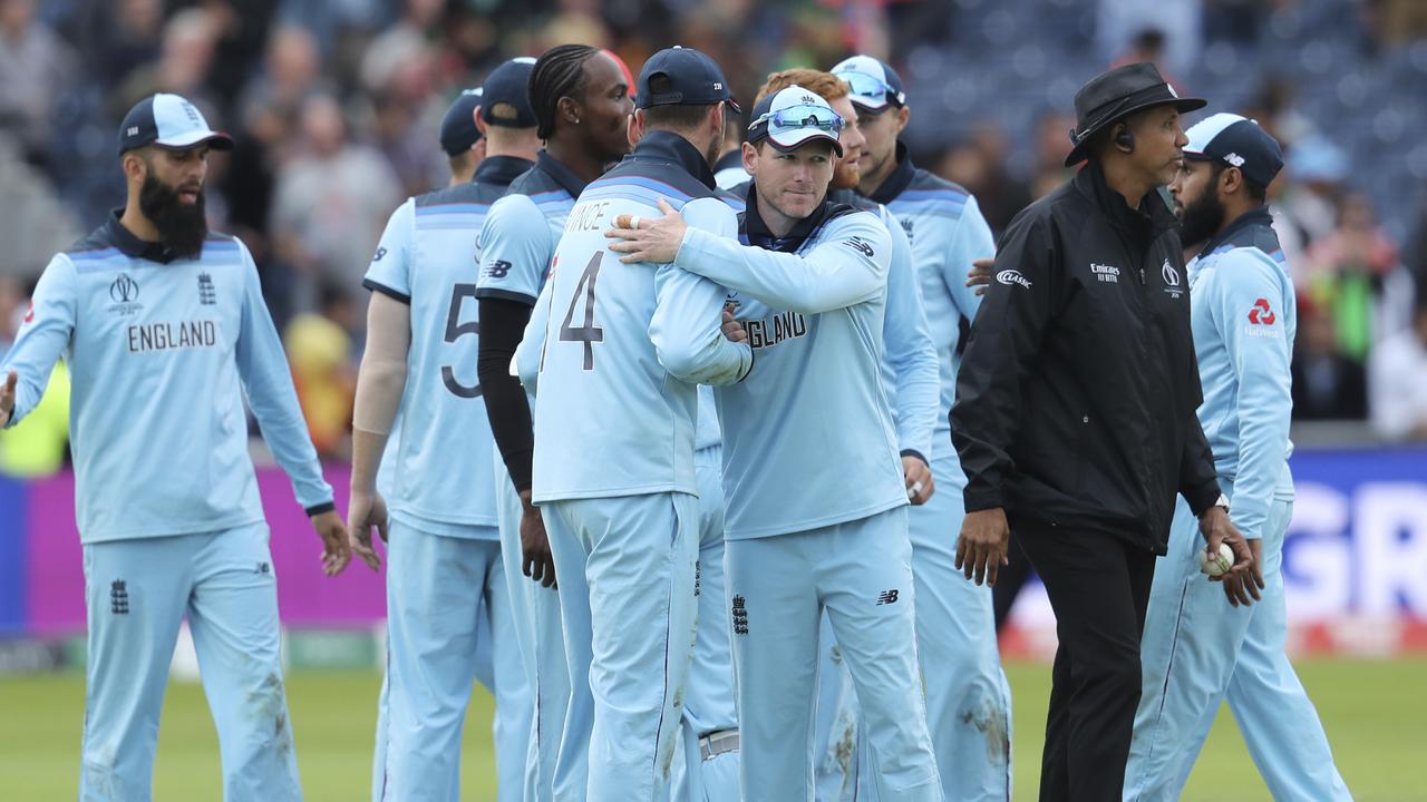 England players celebrate their win over Afghanistan. Photo: Rui Vieira/AP Photo.