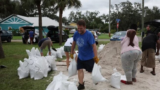 People fill sandbags in St Petersburg as the state prepares for the arrival of Hurricane Milton. Credit: Getty