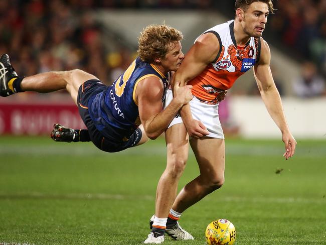 ADELAIDE, AUSTRALIA - MAY 28: Rory Sloane of the Crows tackles Tom Scully of the Giants during the round 10 AFL match between the Adelaide Crows and the Greater Western Sydney Giants at Adelaide Oval on May 28, 2016 in Adelaide, Australia. (Photo by Morne de Klerk/Getty Images)