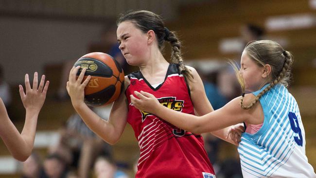 Gosford City Rebels player Jazaya Bickerton under pressure for possession from Central Coast Waves player Izzy Gilham. Picture; Troy Snook