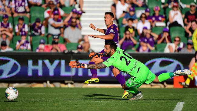 Chris Ikonomidis watches the ball go past Paul Izzo. (Photo by Daniel Carson/Getty Images)