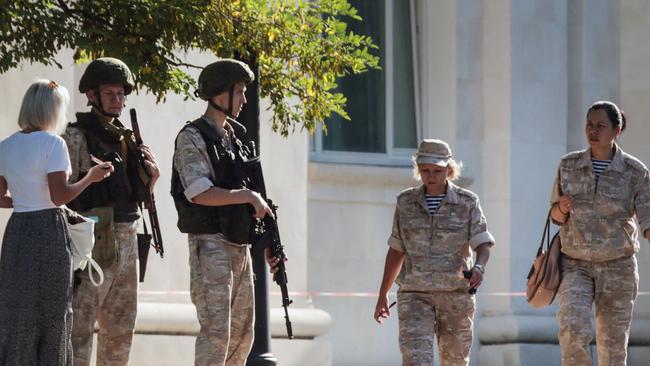 Russian Navy members patrol in front of Russia's Black Sea Fleet headquarters in Sevastopol. Picture: AFP.