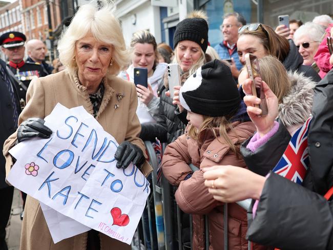 Queen Camilla receives a message of support from young fans for Princess Catherine during her visit to the Farmers’ Market in Shrewsbury. Picture: Getty Images