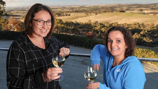 Ali Paulett, left, shares a glass of Paulett's wine — and a glorious view — with Lynn Cameron. Picture: Russell Millard