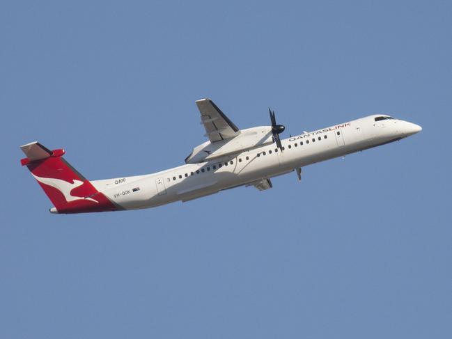 The QantasLink DHC-8 400 Series aircraft, with 74 economy seats.