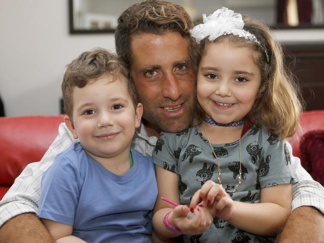 Family ... Noah (L) and Lahela al-Amin pose for a picture with their father Ali Zeid al-Amin. Picture: The Daily Star/Mohammad Azakir