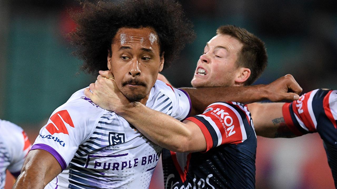 Felise Kaufusi of the Storm is tackled by Luke Keary of the Roosters.