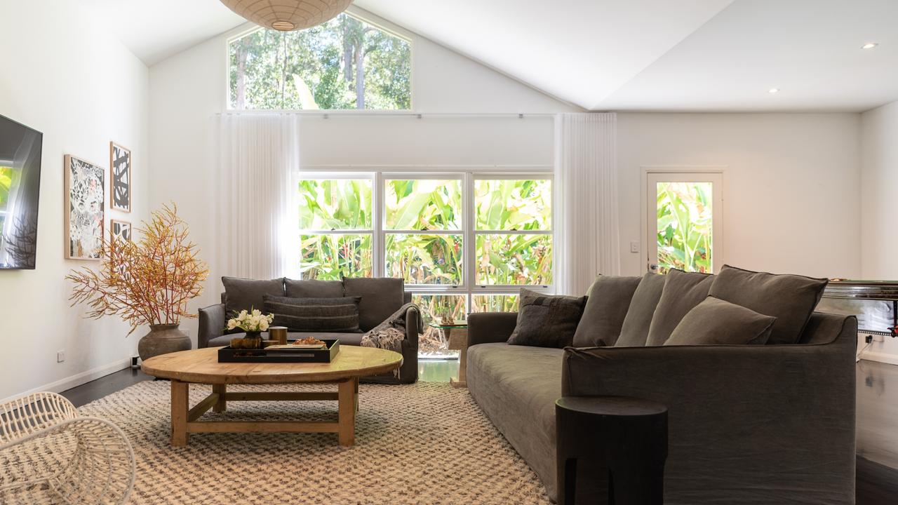 AFTER: The family rooms vaulted ceilings were enhanced with long sheer curtains. Picture: Nadja Farghaly