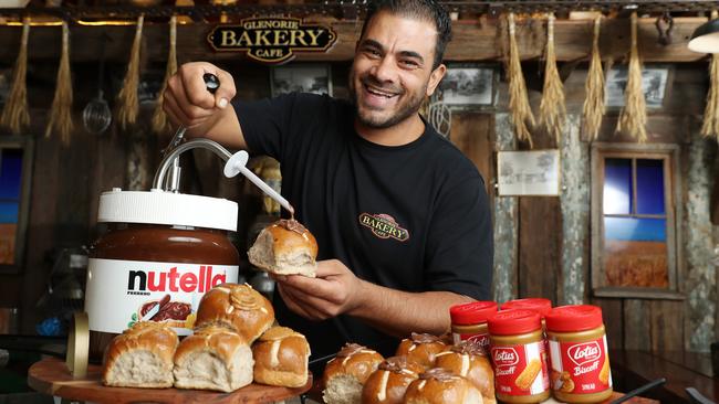 Glenorie Bakery owner Rob Pirina pictured with some of his delicious hot cross bun creations. Picture: David Swift