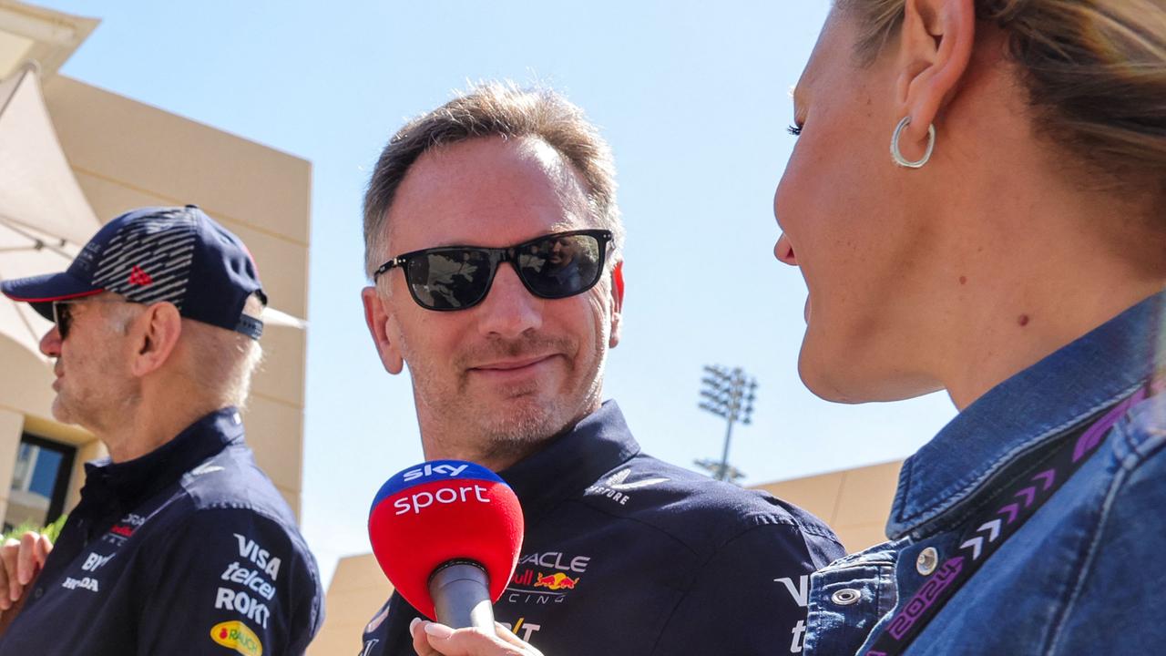 Christian Horner speaks to a reporter as he arrives at the Bahrain International Circuit. (Photo by Giuseppe CACACE / AFP)