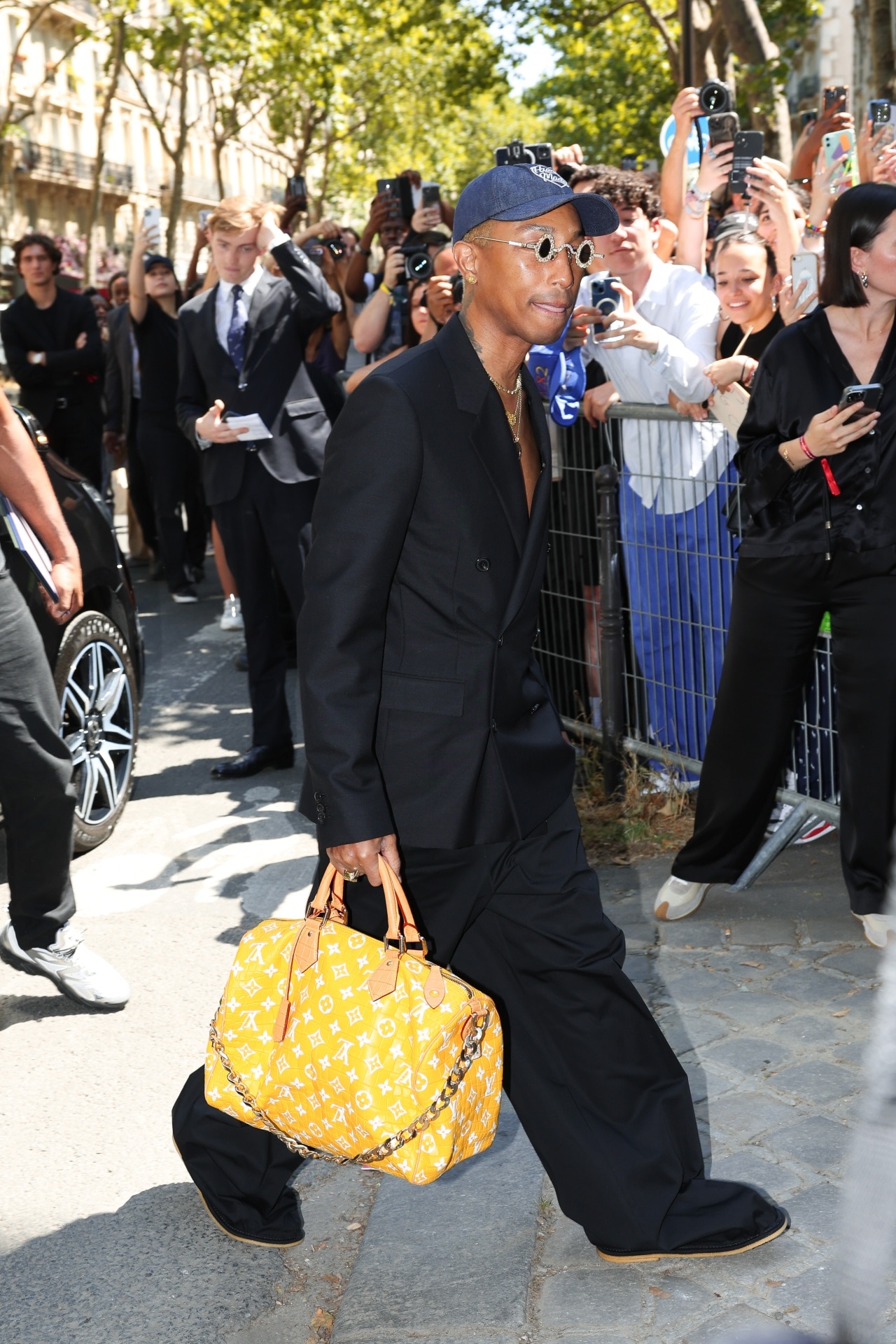 Pharrell shows off the 'Millionaire' Louis Vuitton duffle bag