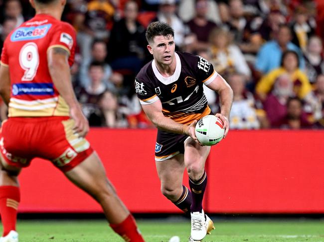 BRISBANE, AUSTRALIA – APRIL 12: Jock Madden of the Broncos looks to take on the defence during the round six NRL match between the Brisbane Broncos and Dolphins at Suncorp Stadium, on April 12, 2024, in Brisbane, Australia. (Photo by Bradley Kanaris/Getty Images)