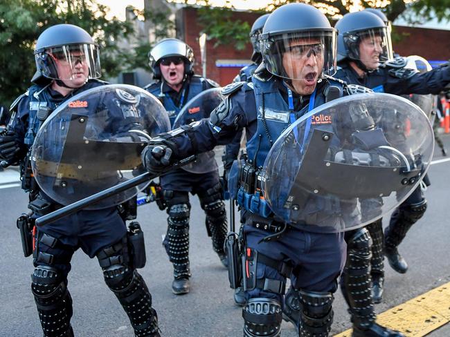 Police in riot gear charge at protesters at the protest outside the Milo Yiannopoulos event. Picture: Jake Nowakowski