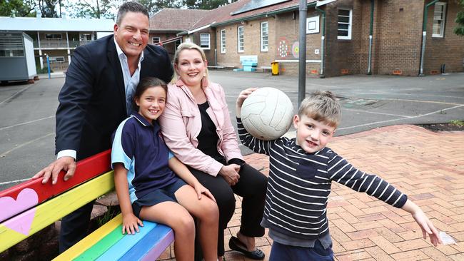 Catholics Nick and Christine Bermand, with children Kate and John, at Waitara Public School in Sydney yesterday. Picture: John Feder.