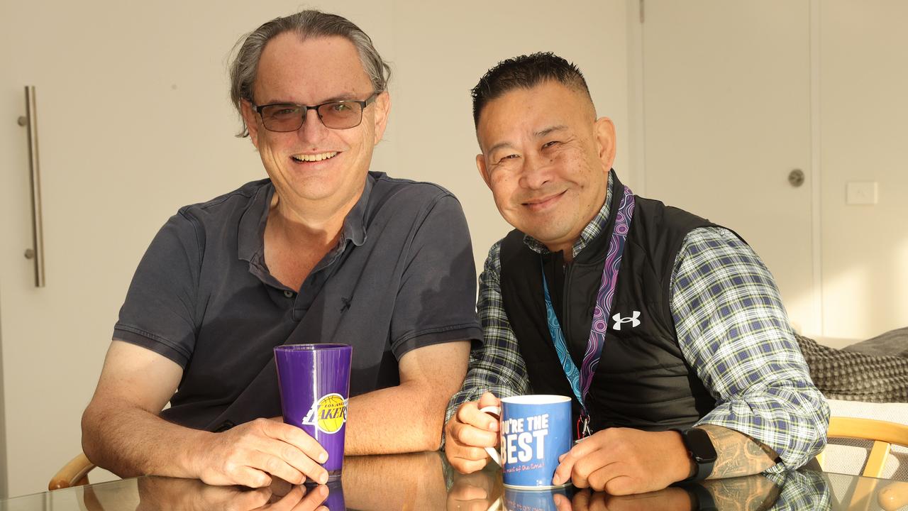 Suri Iskandar (right) experienced homelessness as a teen. He has now found his passion as a home carer. Pictured with client Matthew Schauble. Picture: Alison Wynd