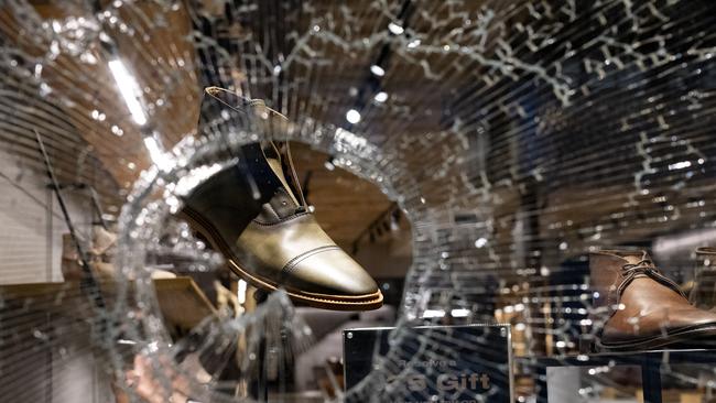 A hole in the glass of a high-end shop in the Chelsea neighbourhood of Manhattan. Picture: AFP