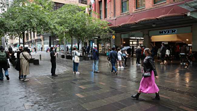 Shoppers line up to enter Myer at Pitt Street Mall in the city on NSW 'freedom day'. Picture: NCA NewsWire / Adam Yip