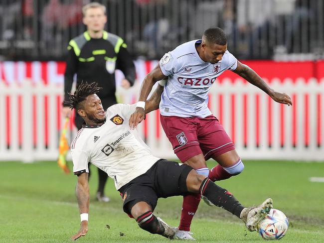 PERTH, AUSTRALIA - JULY 23: Ashley Young of Aston Villa  is tackled by Fred of Manchester United during the Pre-Season Friendly match between Manchester United and Aston Villa at Optus Stadium on July 23, 2022 in Perth, Australia. (Photo by Will Russell/Getty Images)