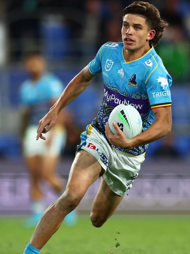 Jayden Campbell of the Titans runs the ball during the round 13 NRL match between the Gold Coast Titans and the North Queensland Cowboys at Cbus Super Stadium, on June 02, 2022, in Gold Coast, Australia. (Photo by Chris Hyde/Getty Images)