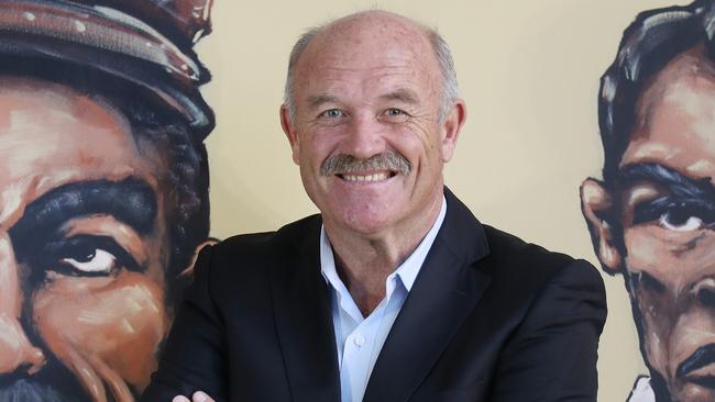 Wally Lewis with the NRL Greats mural wall. Pic Annette Dew