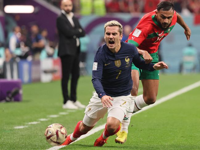 Morocco's midfielder #17 Sofiane Boufal fights for the ball with France's forward #07 Antoine Griezmann during the Qatar 2022 World Cup semi-final football match between France and Morocco at the Al-Bayt Stadium in Al Khor, north of Doha on December 14, 2022. (Photo by KARIM JAAFAR / AFP)