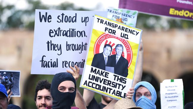 Students hold placards during a protest at the University of Queensland in Brisbane in 2019. Picture: AAP