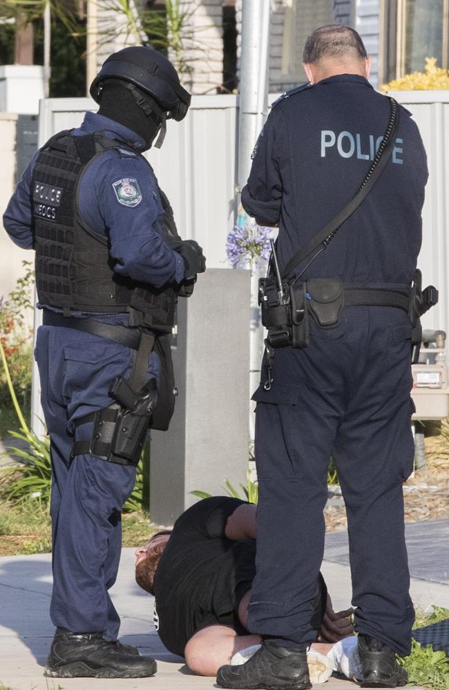 Police raid a Greenacre home and arrest Muhammad Khodar Ali Ahmed. Picture: Jenny Evans