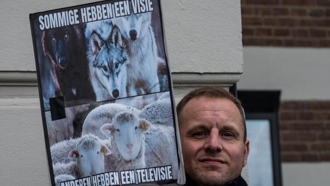 Karel van Klaveren holds a sign during the prohibited anti-Covid measurements demonstration in Amsterdam, Netherlands. Picture: Sanne Derks/Getty Images