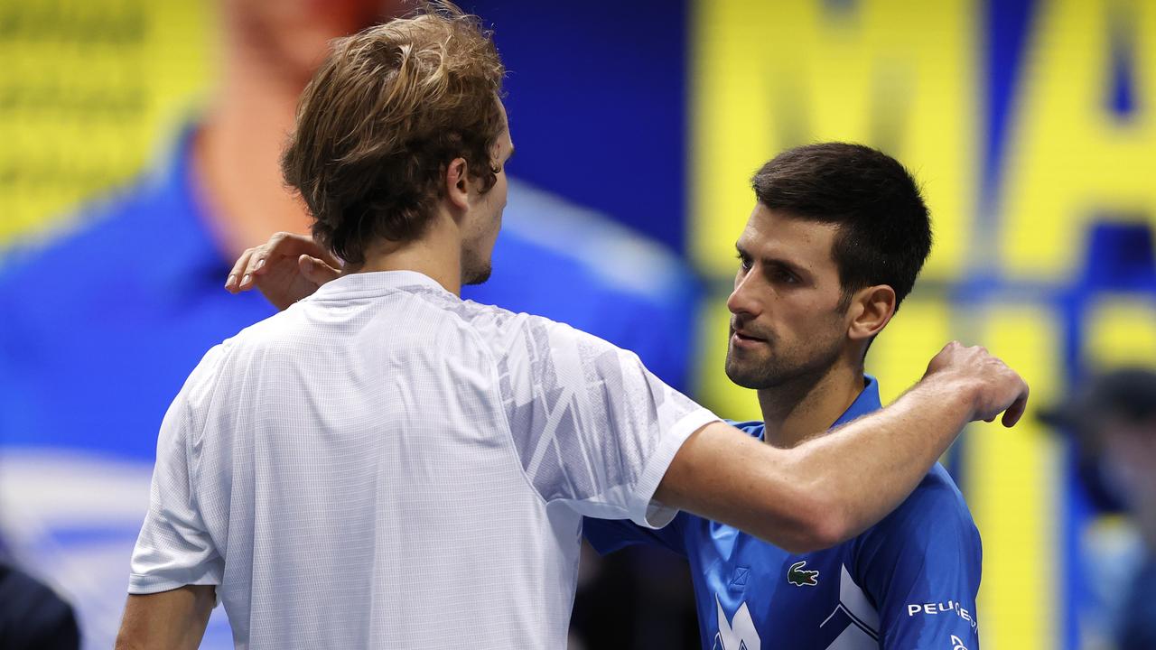 Novak Djokovic embraces Alex Zverev. (Photo by Clive Brunskill/Getty Images)