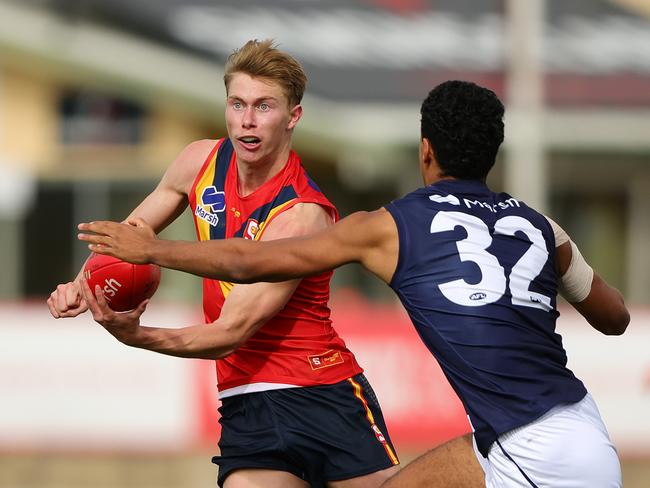 ADELAIDE, AUSTRALIA - June 30: Sid Draper of South Australia and Adrian Cole of Victoria Metro during the 2024 Marsh AFL Championships U18 Boys match between South Australia and Victoria Metro at Alberton Oval on June 30, 2024 in Adelaide, Australia. (Photo by Sarah Reed/AFL Photos via Getty Images)