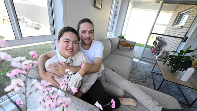 19/7/2024: Mavis Tang 30 and William Naviaux 31, who built their first house in Browns Plains, Brisbane. Hundreds of people are flocking to afford a home in the suburb.  pic: Lyndon Mechielsen/Courier Mail