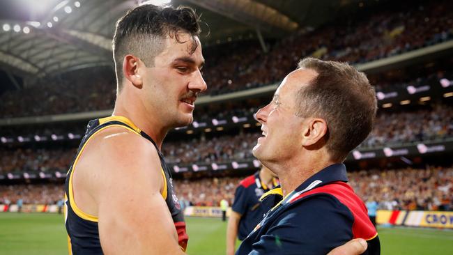 Adelaide captain Taylor Walker and coach Don Pyke celebrate the 2017 AFL preliminary final win over Geelong at Adelaide Oval. Picture: Adam Trafford//Getty Images